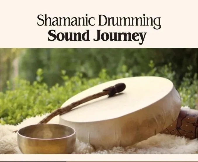 A shamanic drum and a singing bowl on a textured surface outdoors.